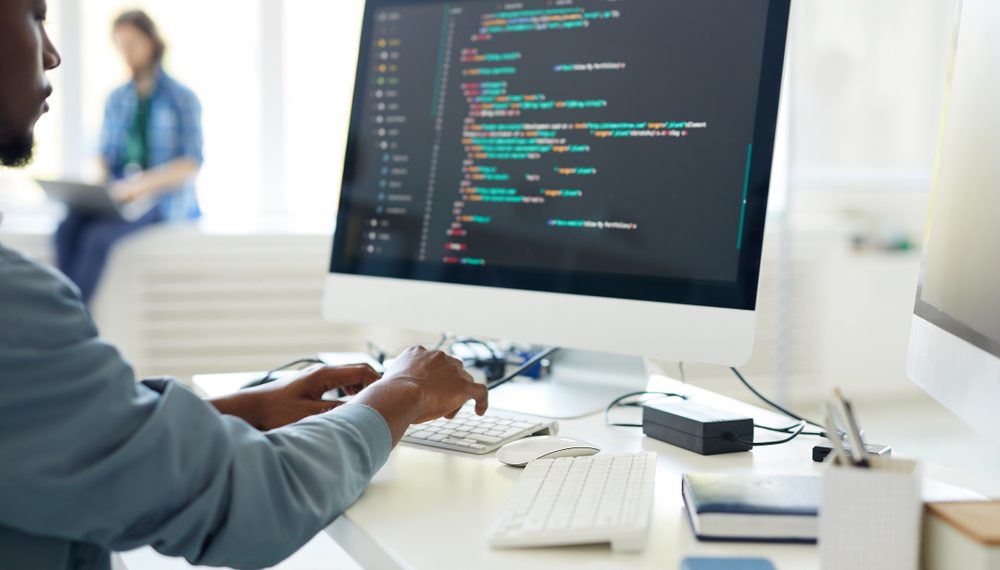 Computer,Programming,Specialist,Working,On,Desktop,Computer,And,Composing,Web